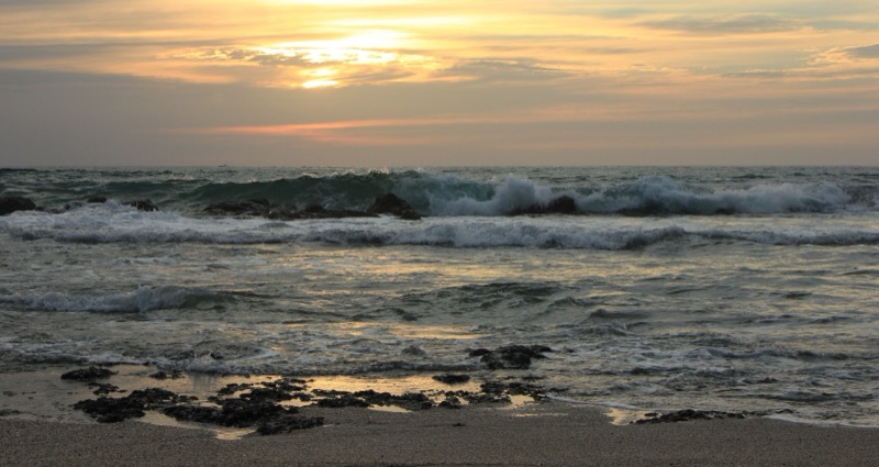 Waves breaking at sunset on Costa Rica's Pacific coast